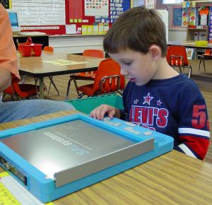 Kindergarten Student Using SAL To Learn Braille